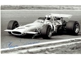 Denny Hulme signed authentic genuine signature photo. COA UACC